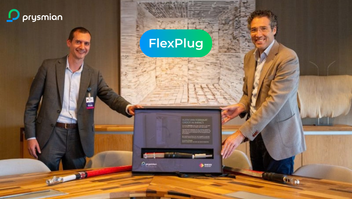Prysmian CEO Dennis Marks and Enexis CEO Rutger van der Leeuw standing beside the FlexPlug medium-voltage substation solution during the agreement signing event.